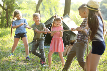 Sticker - little children pulling rope outdoors. summer camp