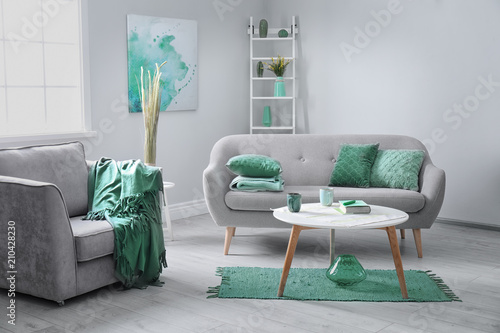 Living Room Interior With Comfortable Armchair And Sofa