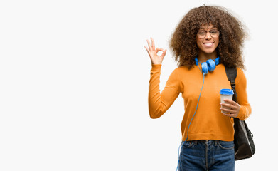 Poster - African american student woman doing ok sign gesture with both hands expressing meditation and relaxation