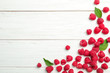 Ripe aromatic raspberries on wooden table, top view