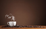 Fototapeta  - Coffee on a brown background with copy space