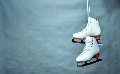 Wall Mural - Women's skates with laces on a gray background.