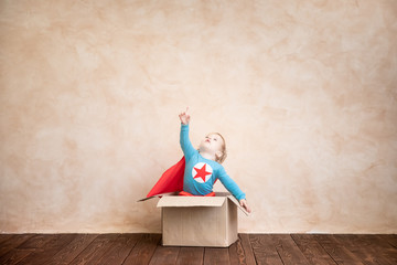 Wall Mural - Superhero kid playing at home