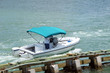 florida Intra-Coastal Waterway near floridSmall runabout motorboat with light blue canvas canopy on the on the Florida Intra-coastal Waterway near Miami Beach.
