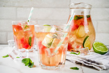 Iced Watermelon And Lime Green Tea With Mint Leaves, Marble White Background Copy Space