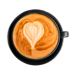Poster - Cappuccino in a black coffee cup isolated on white background, close up. Hot coffee with milk foam with heart shape.
