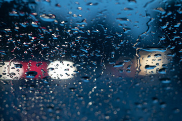 Wall Mural - defocusing. background. evening road, it's raining. colored car lights.