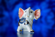 Porcelain Statuette, Porcelain Statuette Of The Elephant On A Blue Background