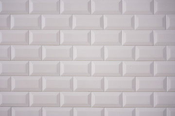  Ceramic rectangular white tile laid horizontally. Glazed white ceramic brick for interior walls