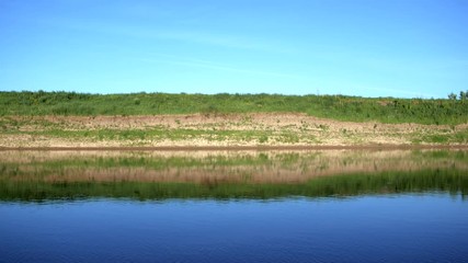Wall Mural - Bright summer nature panorama, forest trees and river with reflection in water, abstract vivid tranquil and relax background