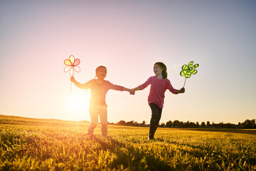 Canvas Print - Children are playing on meadow