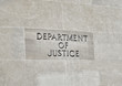 Department of Justice sign on Building Wall