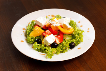 Wall Mural - Greek salad on white table