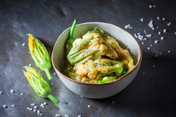 Wall Mural - Homemade and tasty roasted zucchini flower served with salt