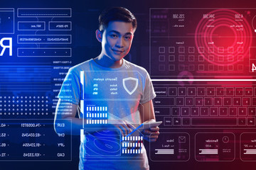 calm programmer. cheerful young programmer wearing casual clothes and looking calm while standing wi