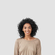 © wayhome.studio  - Smiling delighted young African American female has gentle smile, has white teeth, rejoices meeting with colleagues, dressed in casual clothes, isolated over white background with blank space