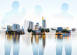 © rh2010 - Silhouettes of business people standing back on the modern cityscape background with skyscrapers in Frankfurt. Double exposure image technic
