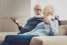Aged Couple. Joyful Aged Woman Looking At Her Beloved Man While Listening To His Jokes