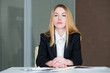 © golubovy - strict and serious company manager. confident business lady in office workspace