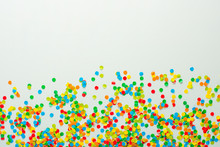 Confetti Scattered In Different Colors On A White Background. Festive Confetti. The Decor For The Party.