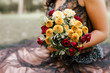 A bouquet of flowers in woman's hands. Vintage colors. Celebration/ special occasion concept.