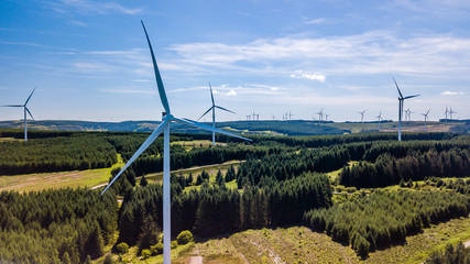 Wall Mural - Aerial drone view of a huge wind farm at Pen y Cymoedd in South Wales, UK