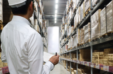 interior of warehouse. Rows of shelves with boxes,Transportation, import-export and logistics concept,