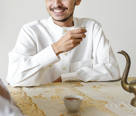 Wall Mural - Muslim man having a cup of tea