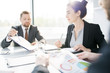 © Seventyfour - Side view portrait of beautiful young businesswoman heading meeting sitting at meeting table in conference room and listening to colleagues ideas, copy space