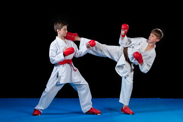 The studio shot of group of kids training karate martial arts