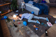 Memory loss. Top view of tipsy mature man lying on floor and having party