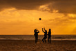 Kids playing with ball on the beach