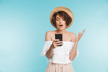 Wall Mural - Portrait of a shocked young woman in summer hat