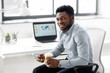 © Syda Productions - business, people and technology concept - african american businessman with smartphone having break and drinking coffee at office
