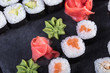 © Abramov Maksim - Японская кухня. Горячие и холодные закуски из морепродуктов. Суши и роллы и креветки. Японская еда и морепродукты в ресторане.