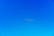 Kite centered in front of a bright blue sky