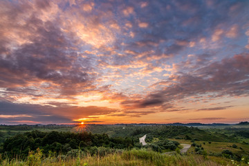 sun and clouds and landscape