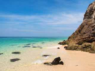 Poster - Beach and turquoise water sea with clear blue sky in sunny summer day for vacation holiday concept.