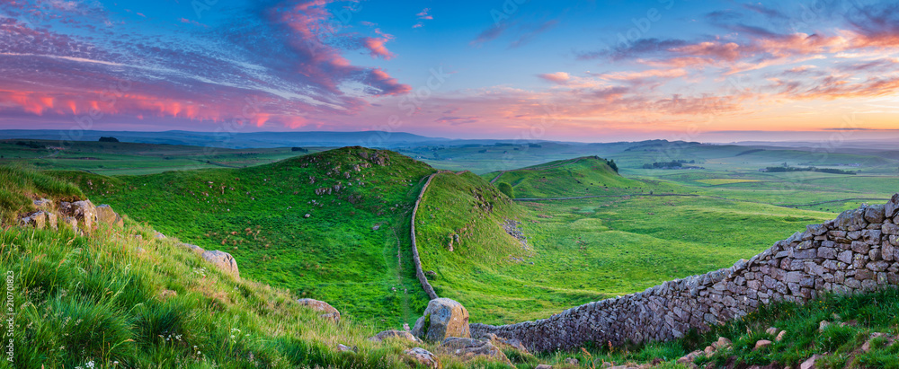 Twilight Panorama at Hadrian's Wall / Hadrian's Wall is a World Heritage Site in the beautiful Northumberland National Park. Popular with walkers along the Hadrian's Wall Path and Pennine Way - obrazy, fototapety, plakaty 