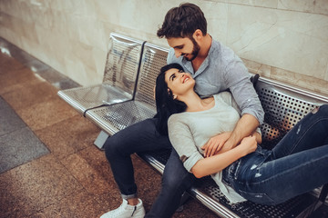 Wall Mural - Young romantic couple in subway