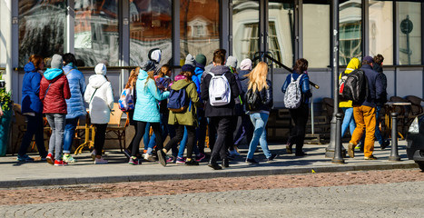 happy positive children during sightseeing tour in old european