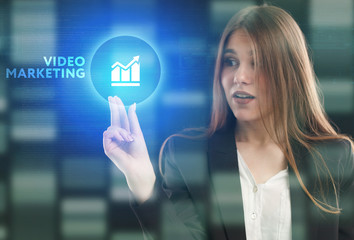 The concept of business, technology, the Internet and the network. A young entrepreneur working on a virtual screen of the future and sees the inscription: Video marketing