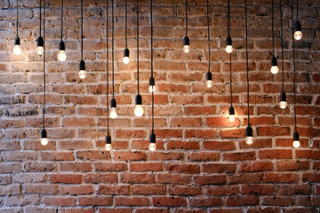 Fototapeta old brick wall with bulb lights lamp