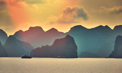 Wall Mural - Halong bay boats,Sunset at Ha Long Bay scenic view , Hanoi, Vietnam , Southeast Asia