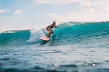 Surfer Girl On Surfboard. Surfer And Wave