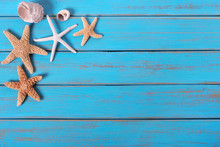 Several Starfish Old Weathered Blue Beach Wood Deck Background