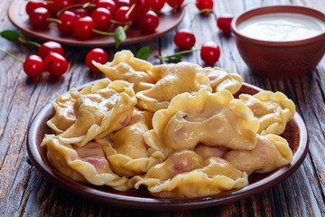 Sticker - hot cherry dumplings on a clay plate