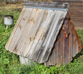 The basis of a old rural well is made of concrete rings.