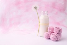 Its A Girl Pink Theme Baby Shower Or Sip And See Party Background With Decorative Elements - Booties And Milk Bottle. Minimal, Copy Space.