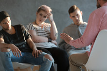 Psychotherapist Supporting Difficult Teenagers During Group Therapy